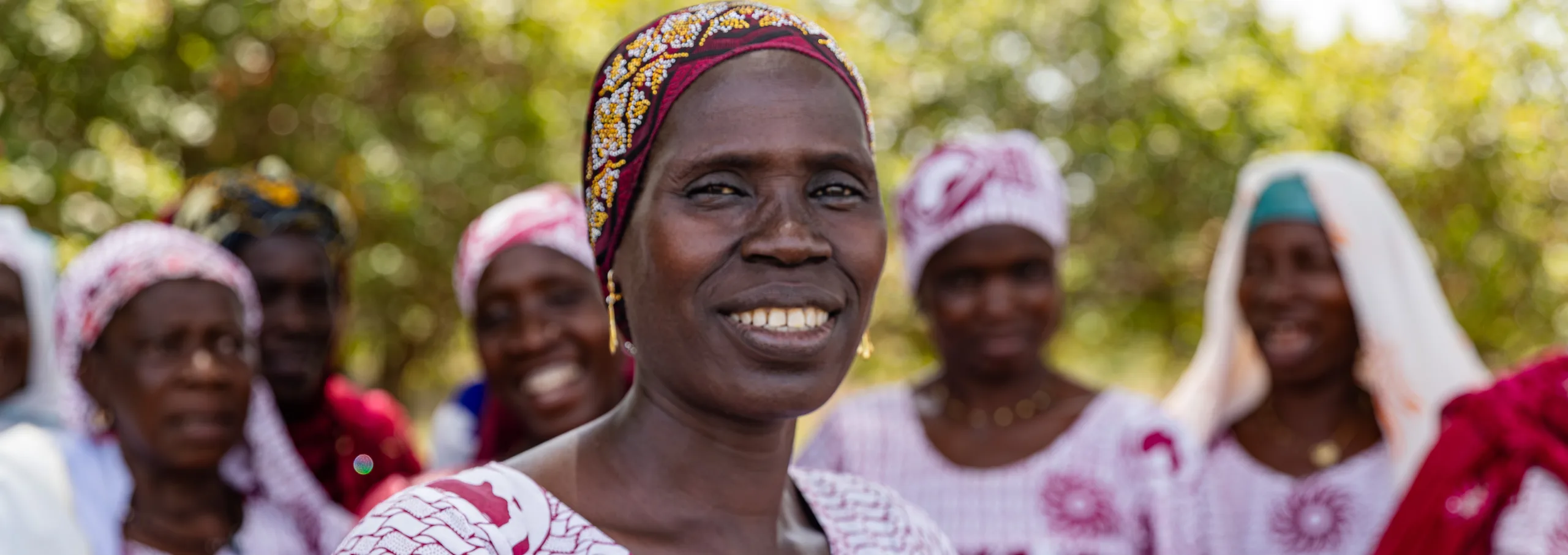 A smiling woman among a group of women